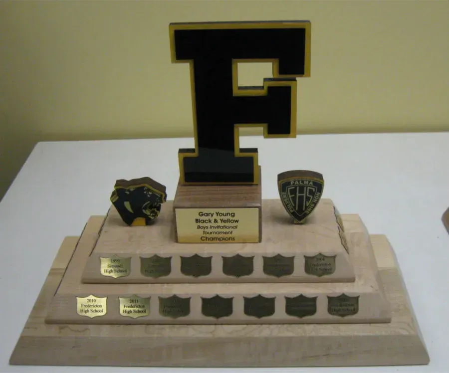 A trophy that has the letter f on it