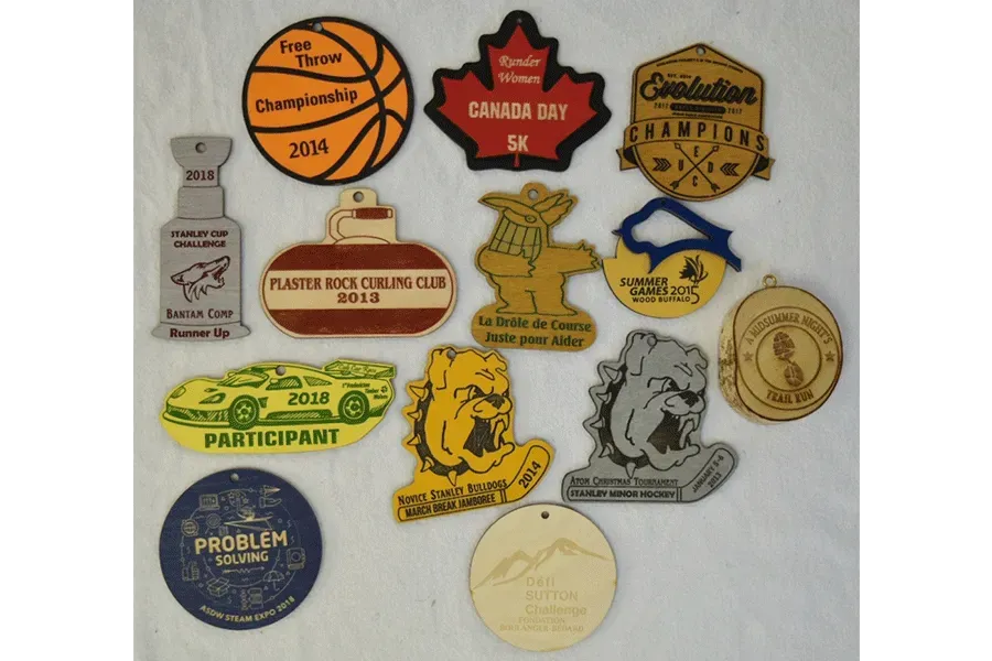 A bunch of wooden medals with one that says problem on it