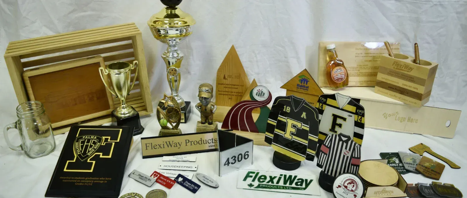 A collection of trophies and plaques including one that says flexiway