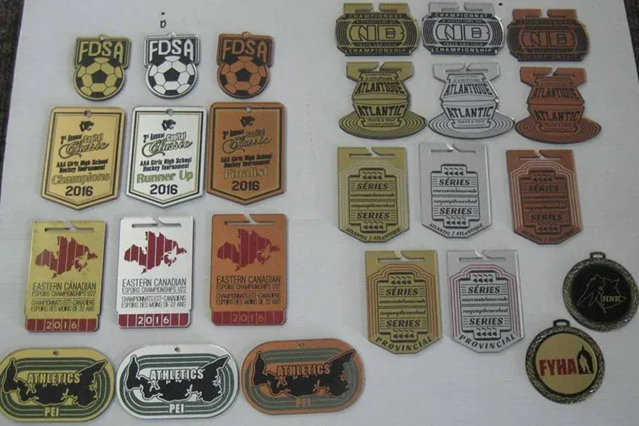 A bunch of medals with one that says final on it