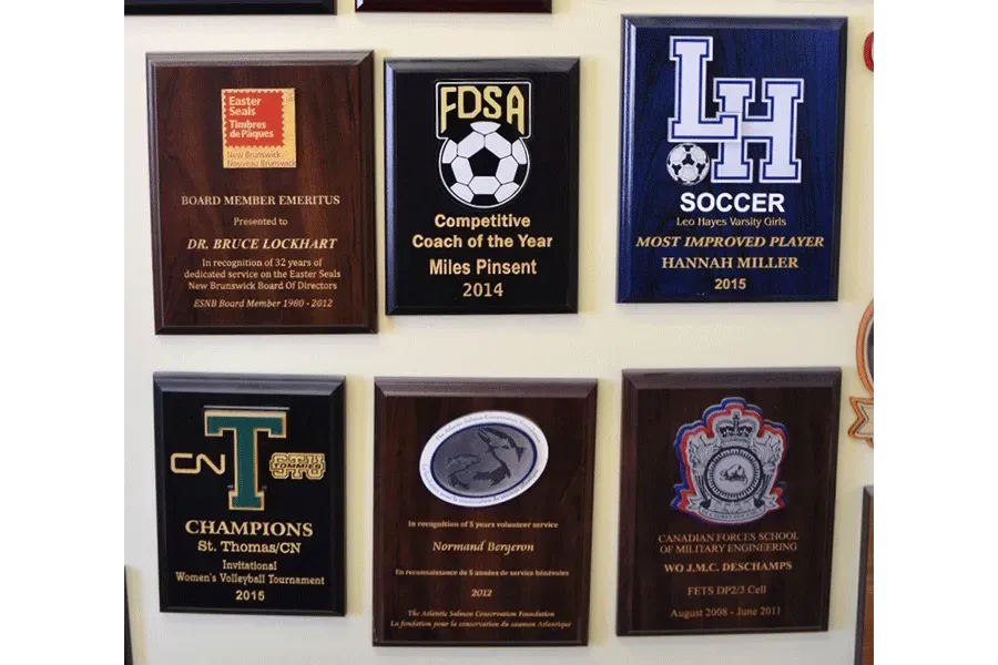 A wall of plaques including one for fdsa soccer