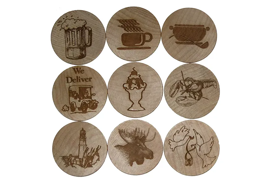 A set of wooden coasters with different images on them