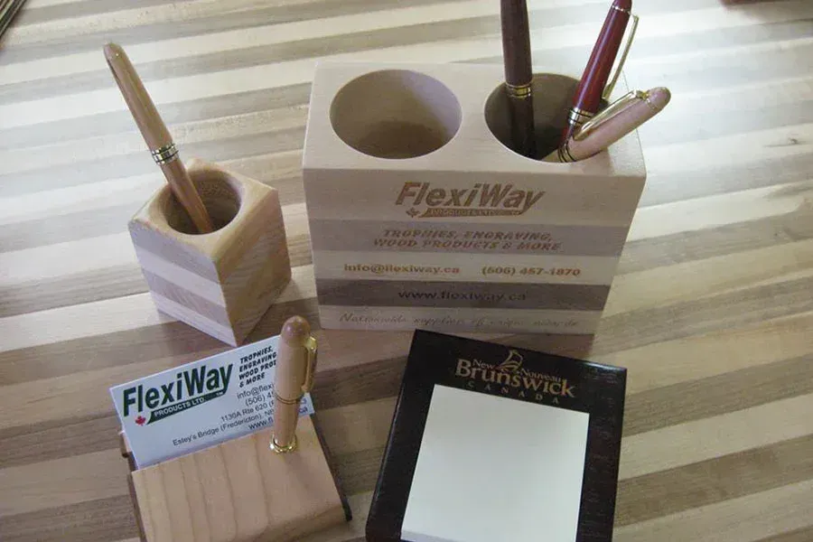 A wooden pen holder with flexiway written on it
