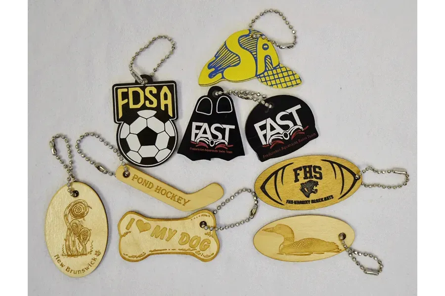 A bunch of keychains with one that says i love my dog