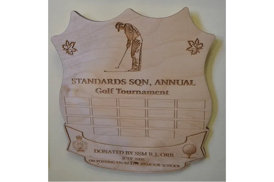 A wooden plaque for the standards sqn annual golf tournament