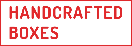 A sign that says handcrafted boxes in red letters on a white background.