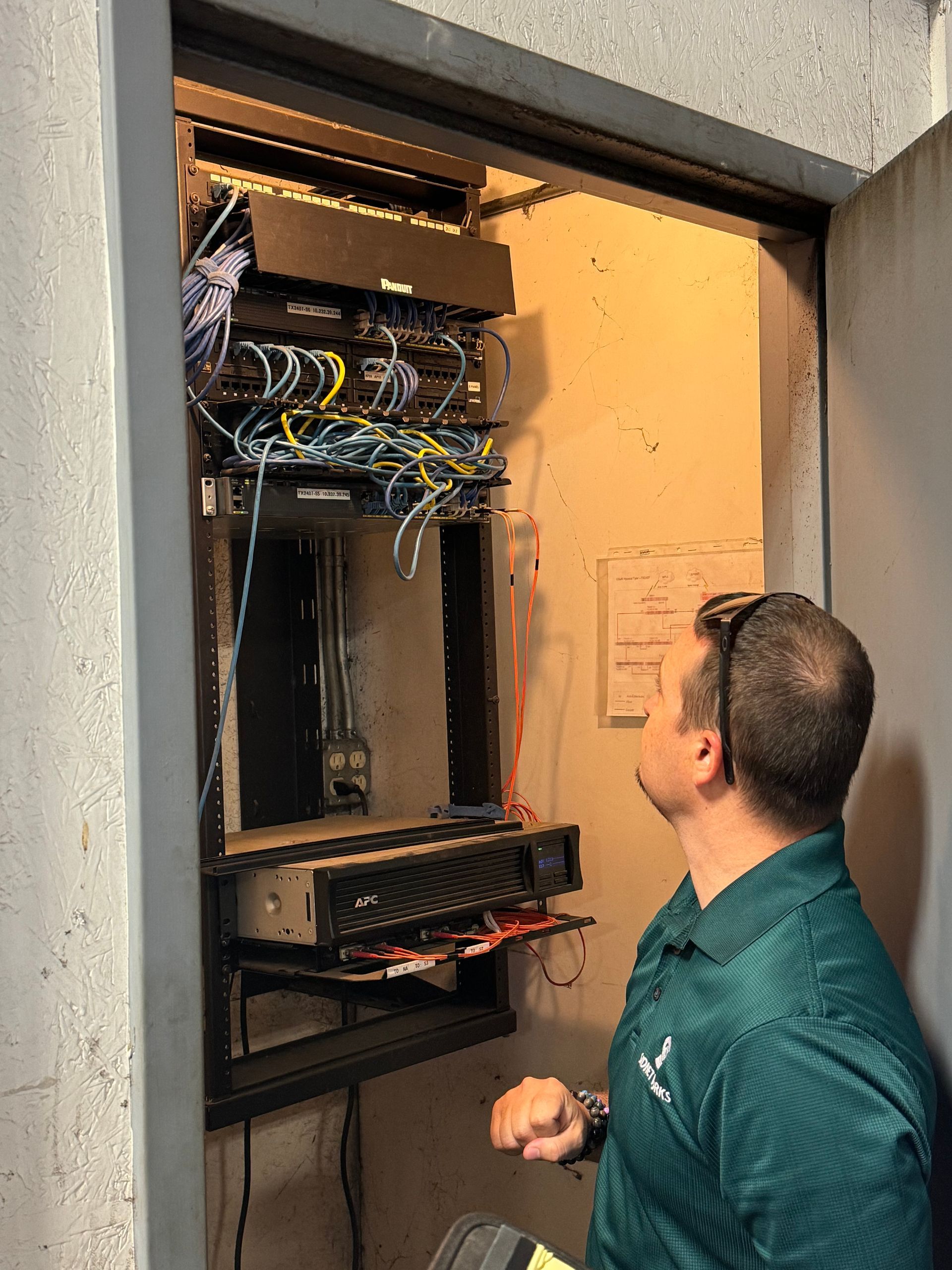 Andrew inspecting a network closet