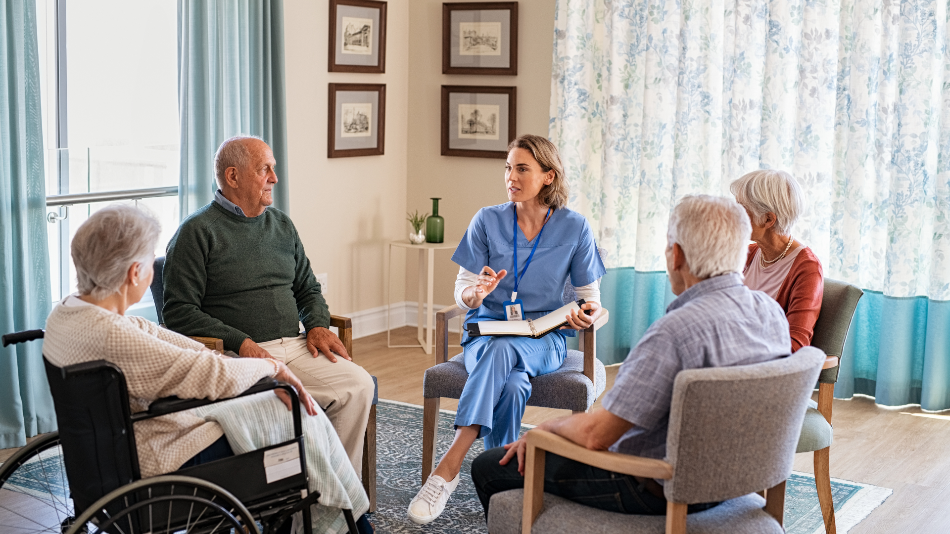A nurse is talking to a group of elderly people in a living room.