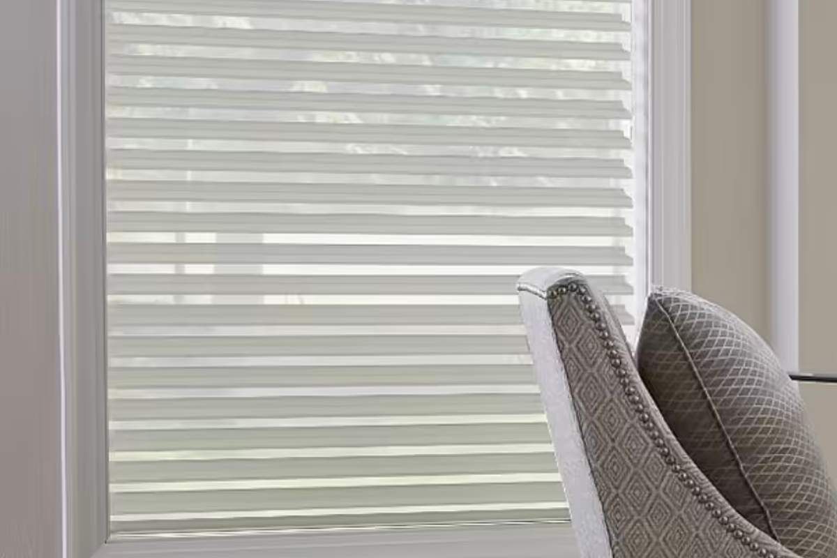 a chair is sitting in front of a window with sheer shadings on it Simply Windows.