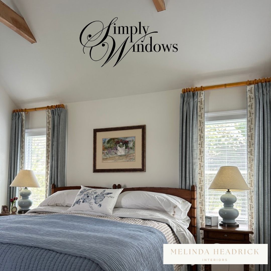 A lovely blue bedroom has custom drapery and layered window treatments - simply windows, ma