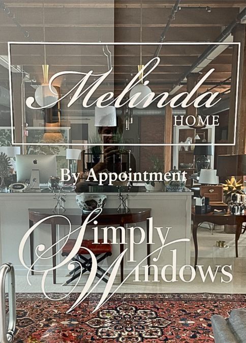 a store front with a sign that says `` melinda home by appointment '' . Simply Windows