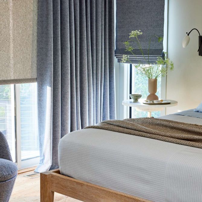 A bedroom snapshot shows blue drapes, matching roman shades, and white roller shades.