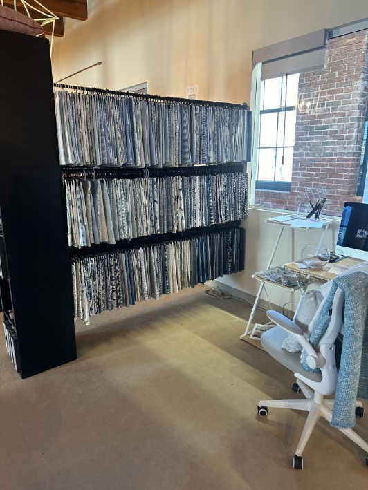 A wall of fabric samples at Simply Windows Boston showroom. 