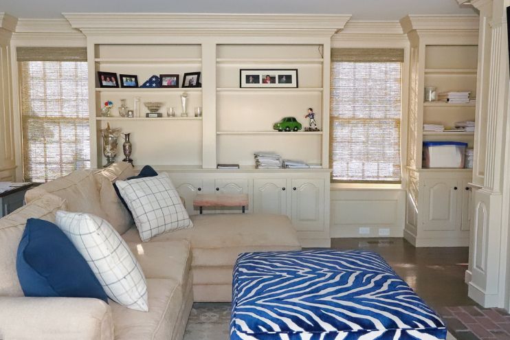 Window Treatments: Elegance Blended With Efficiency - A living room is decorated in blue. 