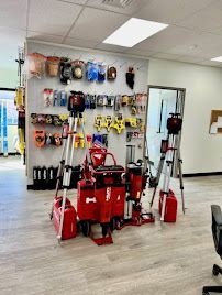Laser levels and hand tools neatly displayed in showroom with clean floors and white walls. Laser levels and hand tools neatly displayed in showroom with clean floors and white walls.