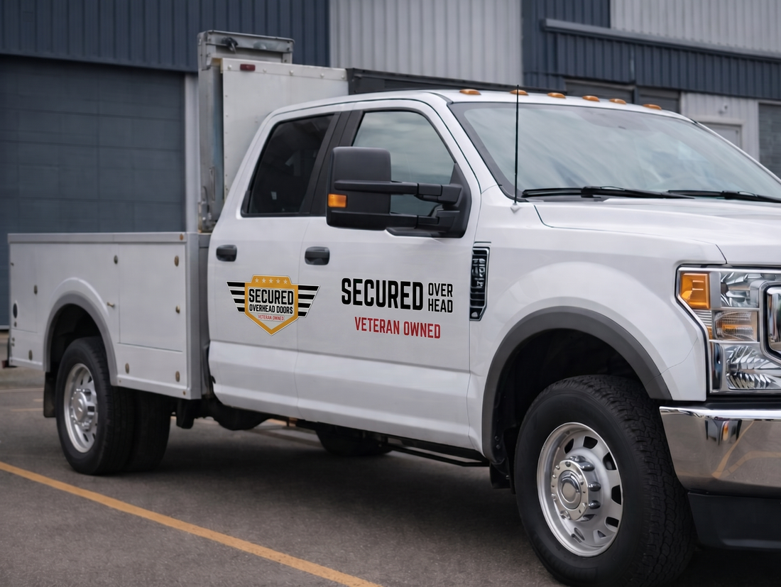White service pickup truck with “Secured” logo parked outside an industrial building
