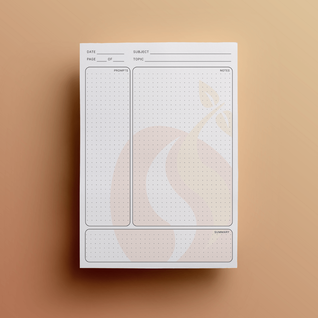 White notepad with dot grid and minimalist design against an orange background.