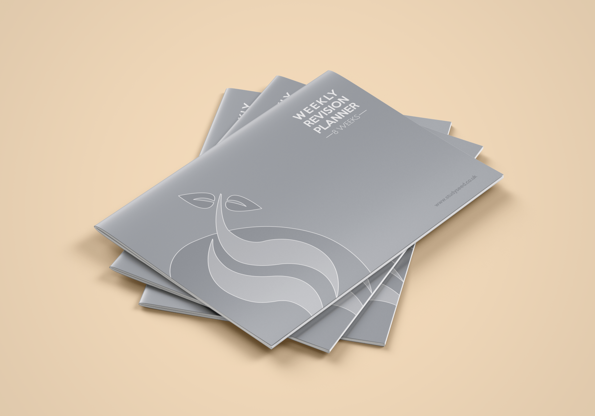 Gray booklets stacked on a beige surface, with a wave graphic and text on the top cover.