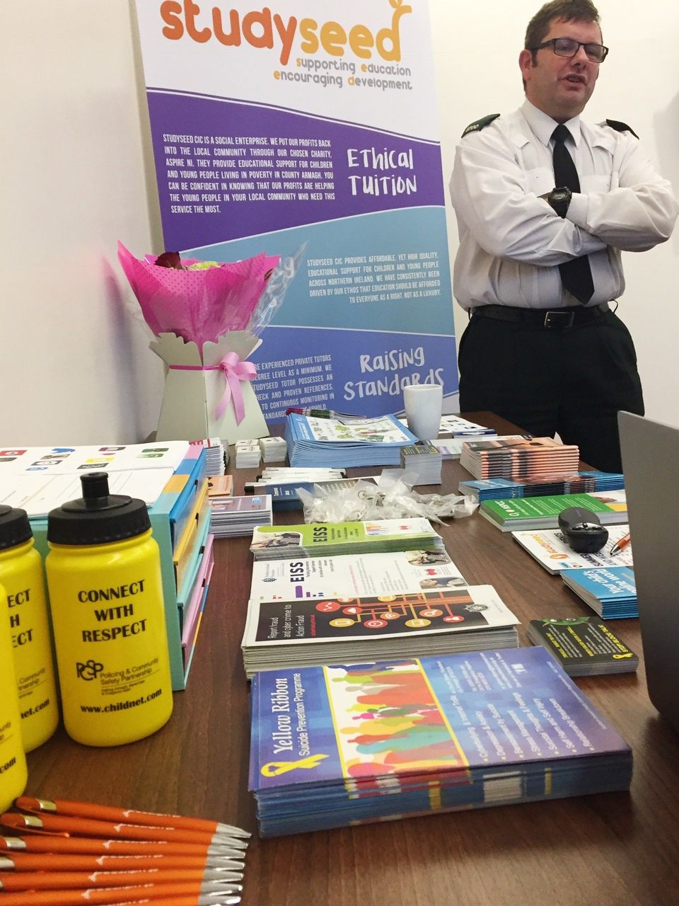Studyseed CIC - Constable Gary from Craigavon PSNI with literature on child safety and wellbeing
