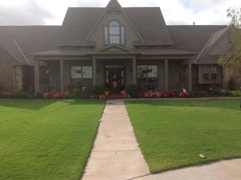 A large house with a walkway leading to it