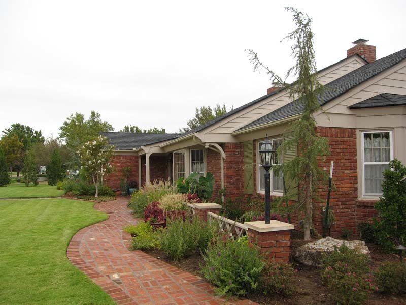 A house with a brick walkway leading to it
