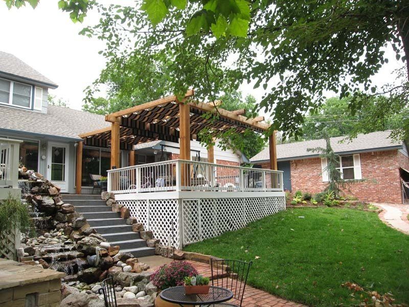 A house with a large deck and stairs leading up to it
