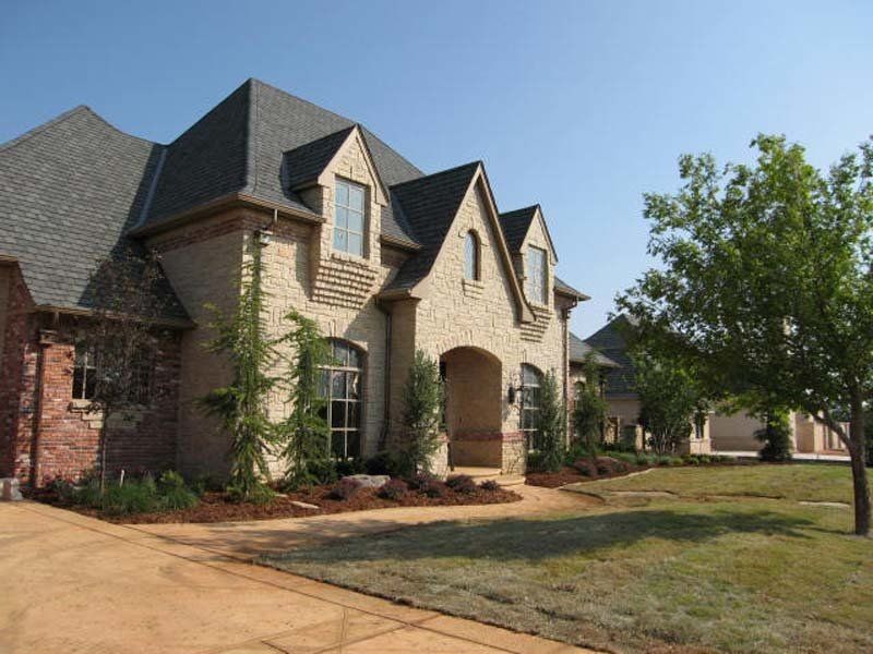 A large brick house with a gray roof
