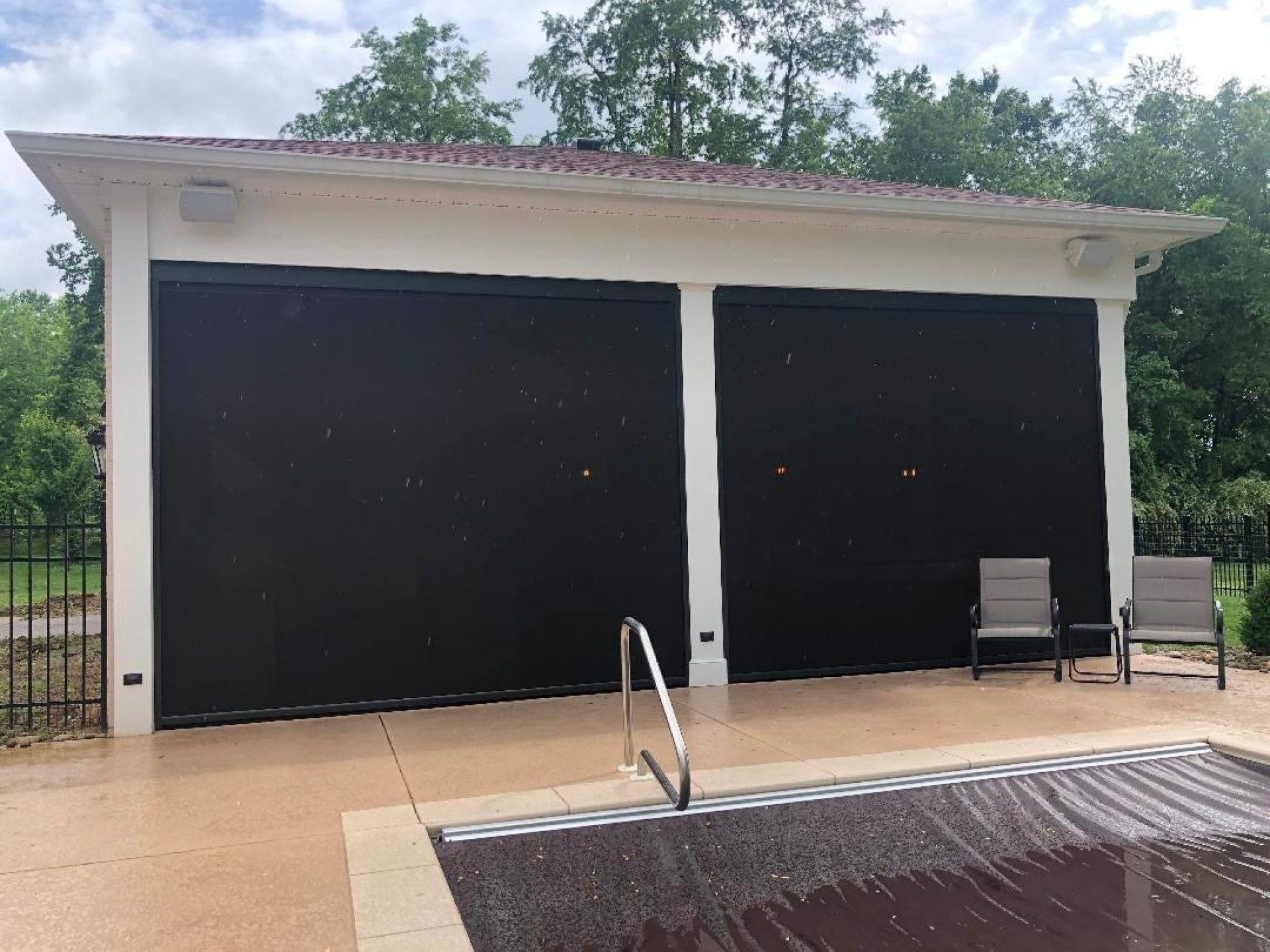 A building with a swimming pool in front of it