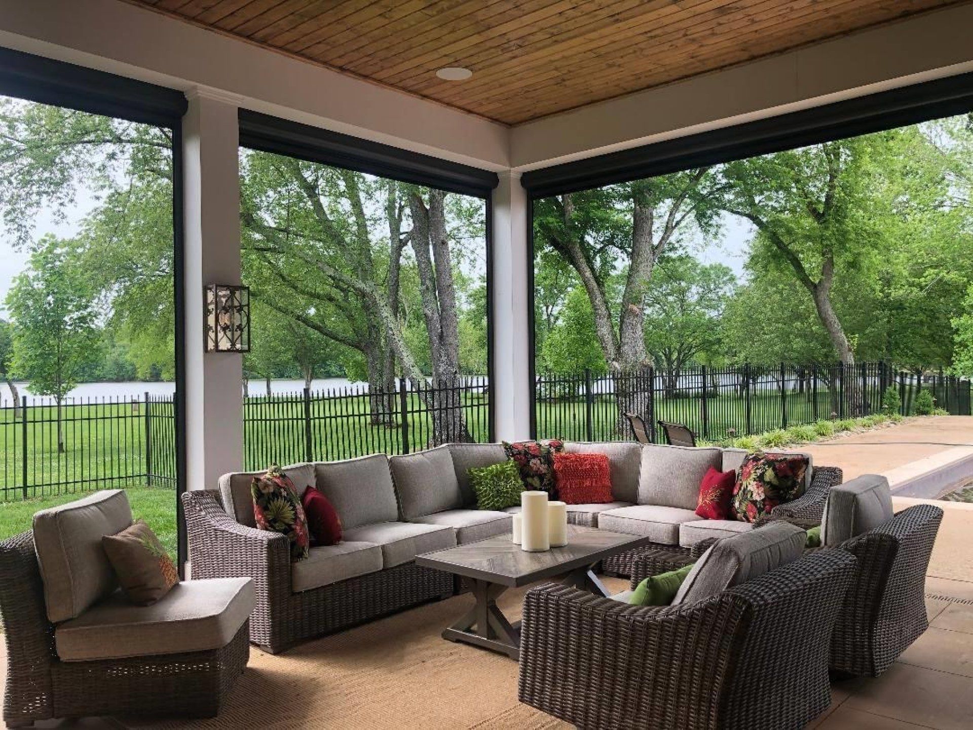 A living room with a large sectional couch, chairs, and a coffee table.