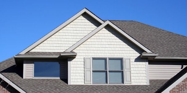 Durable asphalt shingle roof installation on a residential home, highlighting quality craftsmanship.