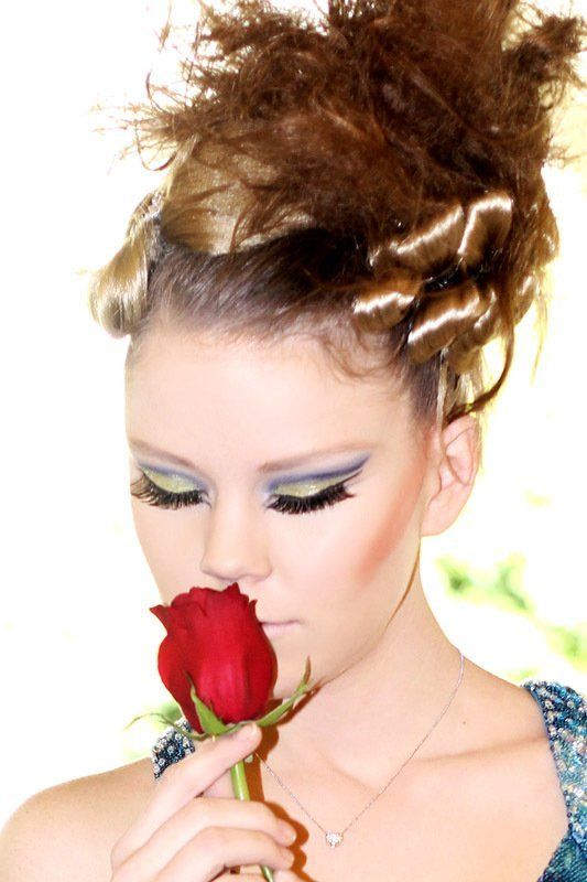 Woman Holding a Rose — in Glendale, CA — AML Academy Makeup & Hair