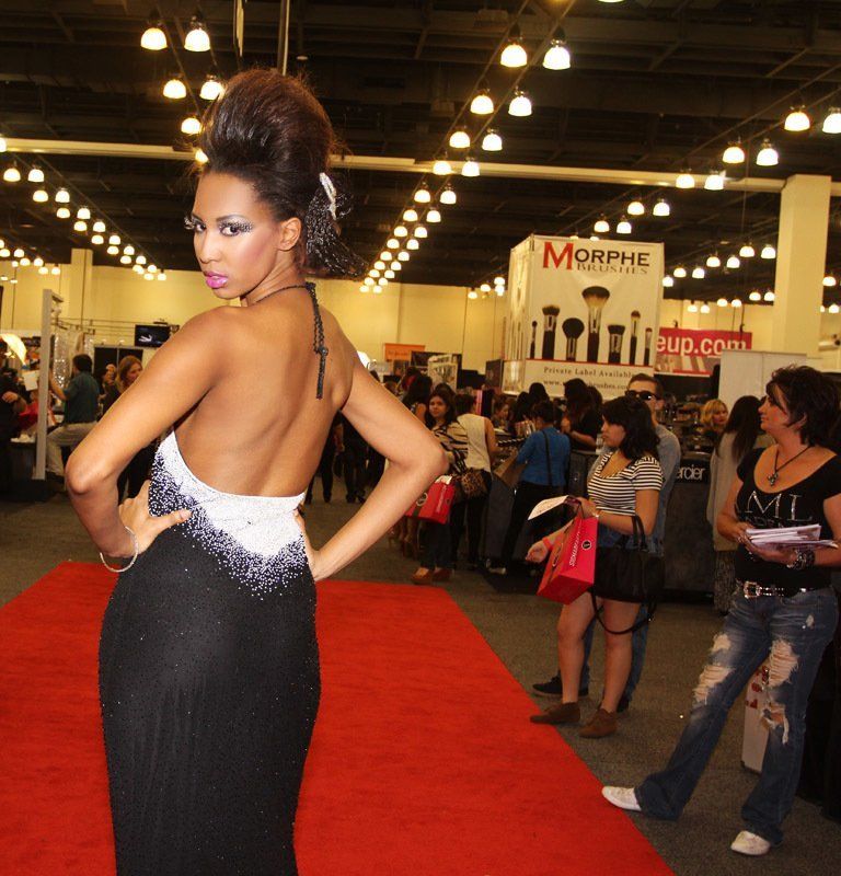 Women Posing Wearing a Backless Gown — in Glendale, CA — AML Academy Makeup & Hair