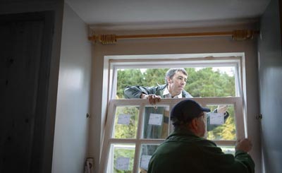 Two Men Installing The Window — St. Louis, MO — Edelen Door & Window