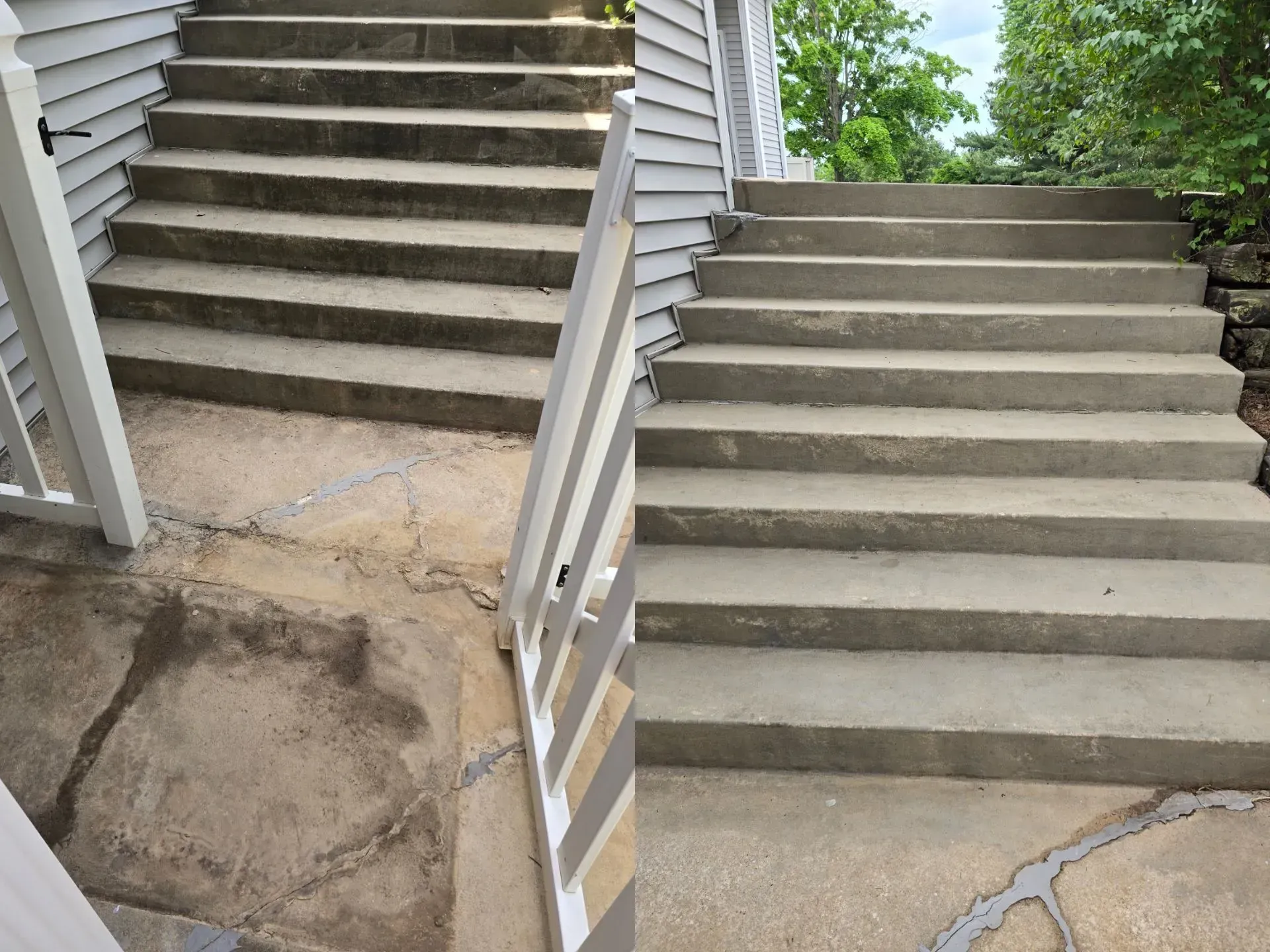 A set of concrete stairs leading up to a house.
