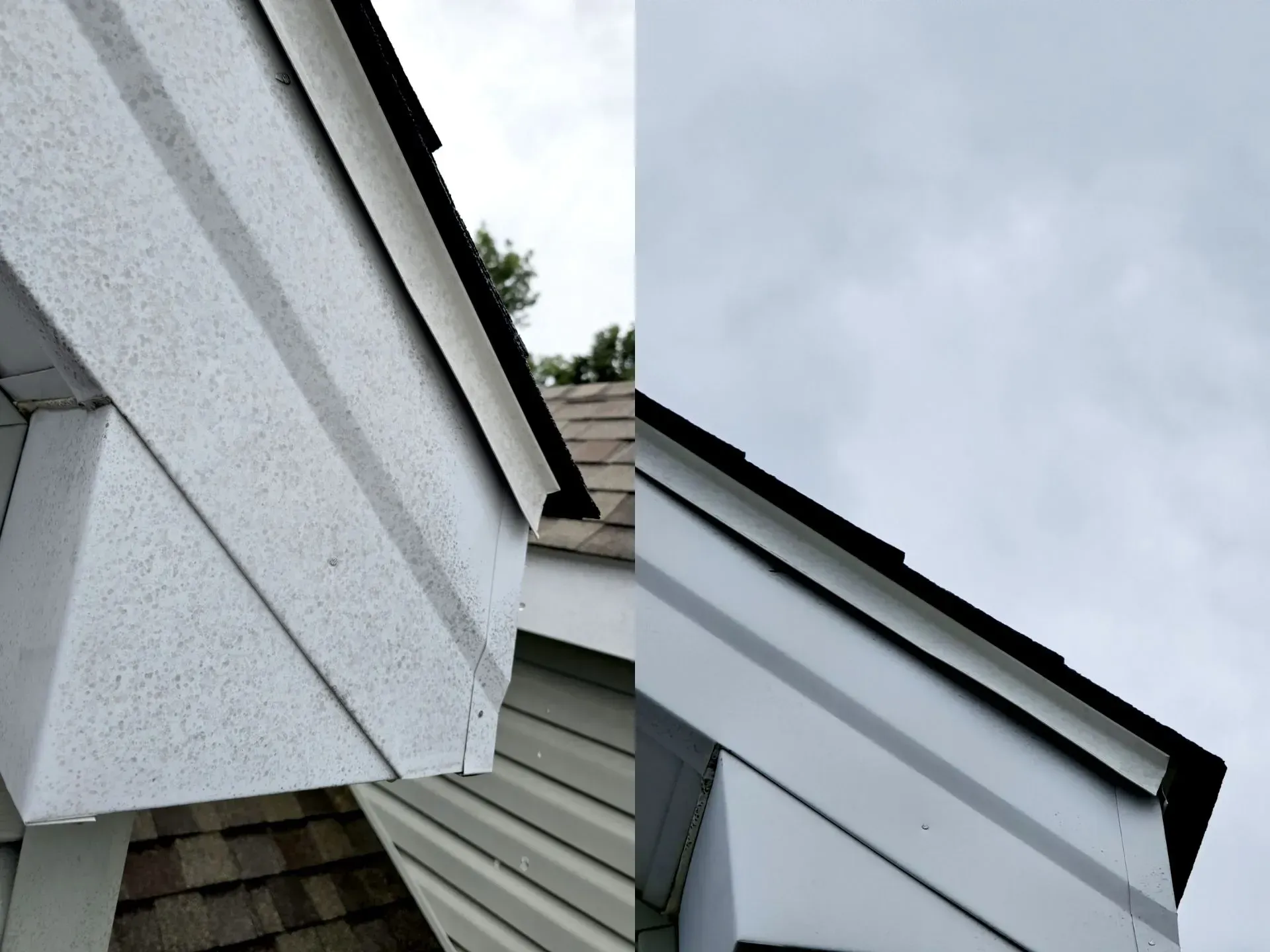 A white house with a black roof and a white trim