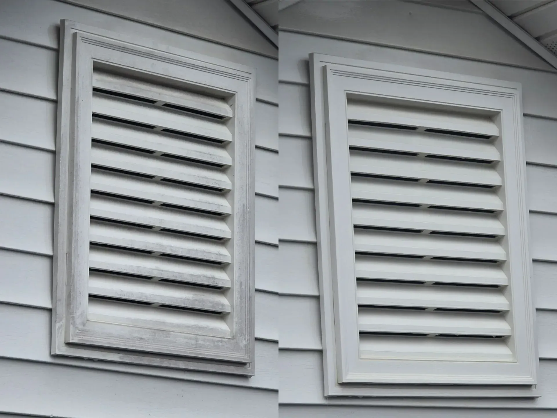 Two white shutters on the side of a house