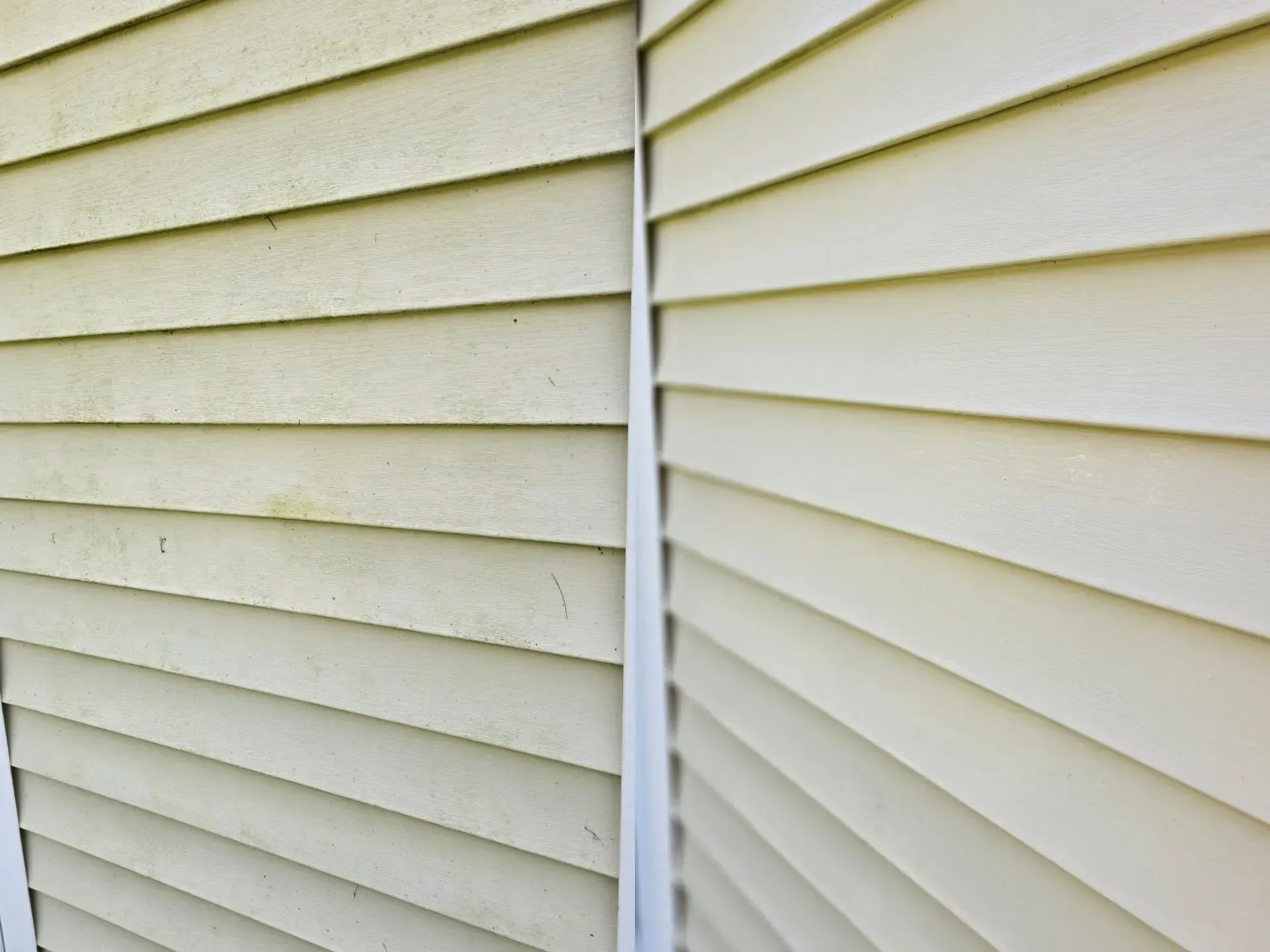 A close up of a white siding on a house