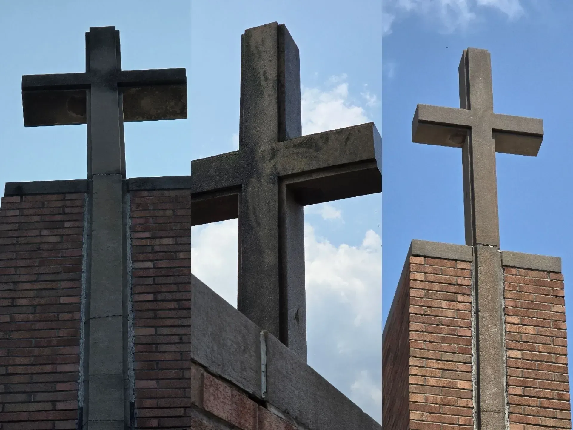Three crosses on a brick wall with a blue sky in the background