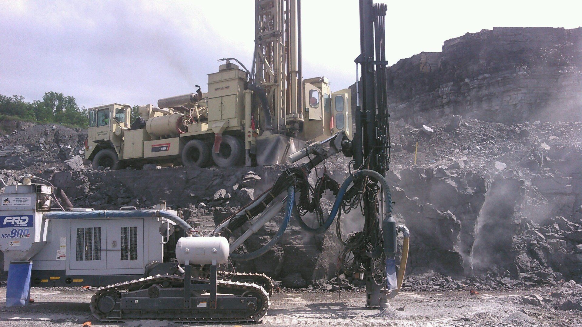 a large drill is drilling a hole in the ground