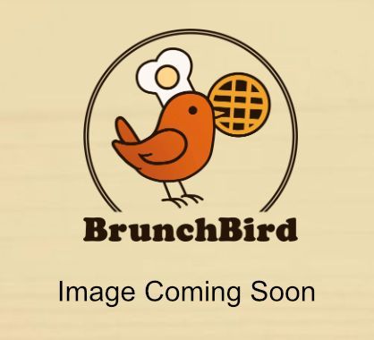 Grilled chicken sandwich with cheese, tomato, and lettuce on toasted bread.