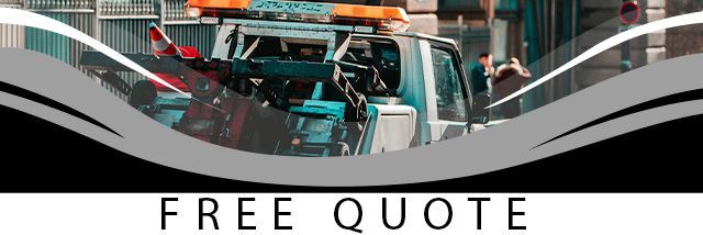 Free Auto Glass Quote Banner. Orange banner in front of two people replacing a windshield.
