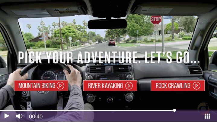 A video of a person driving a car that says pick your adventure let 's go