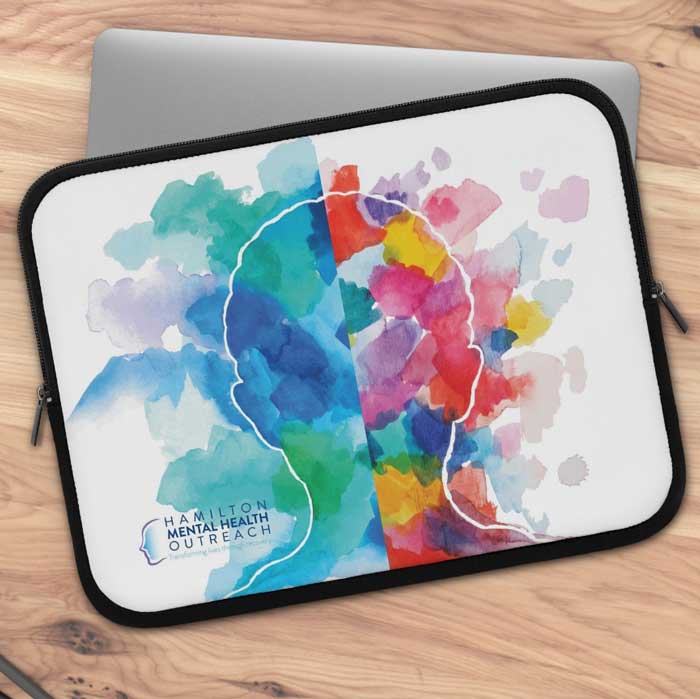 A hamilton mental health outreach laptop case on a wooden table