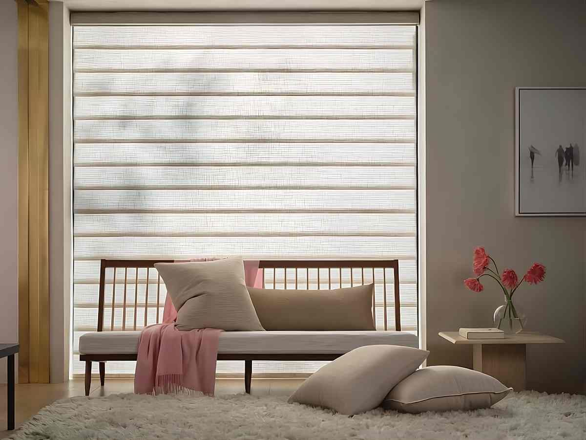 Roman Shades as sound-absorbing window treatments on a window with a modern couch and throw pillows  near West Chester, Ohio (OH) and Florence, Kentucky (KY)