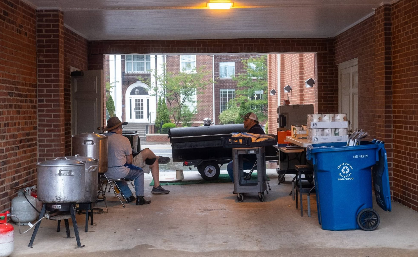 Steadfast Grillmaster's helping Hall-Wynne Funeral Home and Crematory feed BBQ to the Durham and Raleigh Communities