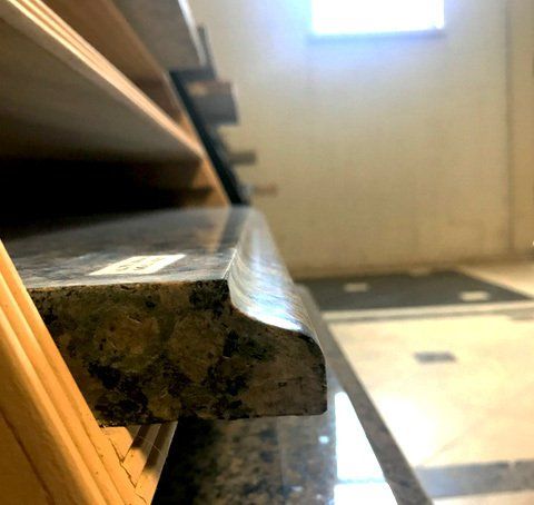 A close up of a granite counter top in a room