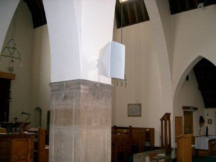 For a church sound system call us on 01782 626 295 A pillar in a church with a speaker on it.