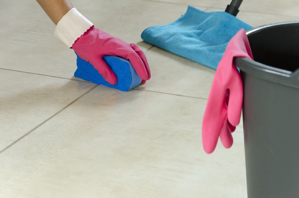 A Person Is Removing Tile Grout - Carpet 2 Couch in Condon, QLD