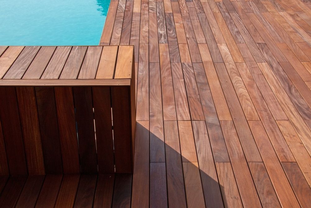 Wooden Deck and Built-In Bench Next to A Swimming Pool, Showcasing Natural Wood Grain — Carpet 2 Couch In Condon, QLD