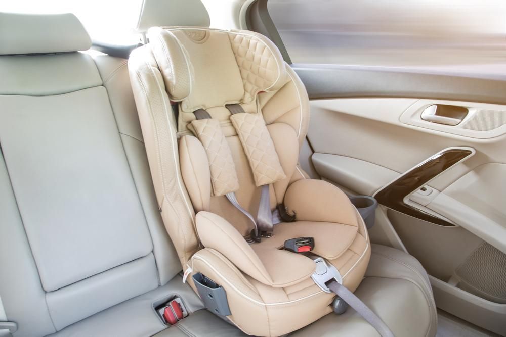 A Car Seat Is Sitting In The Back Seat Of A Car — Dancers Car Care In Ballina, NSW